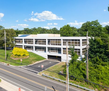 an image panoramic up side of building showing covered parking