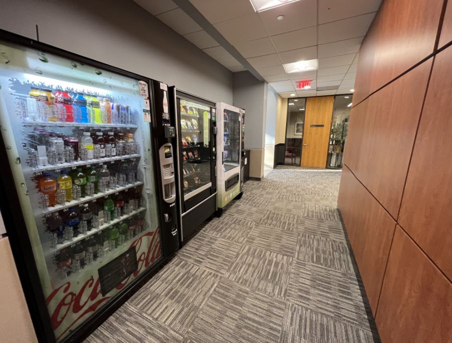 an image of another angle of hallway an food machines
